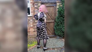 Pink haired crossdresser in sexy back satin dres