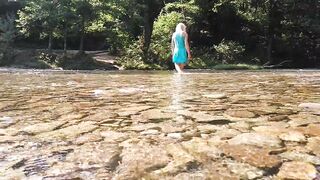 Sexy t-girl swimming in mountain river and wetting teal summer dress ...