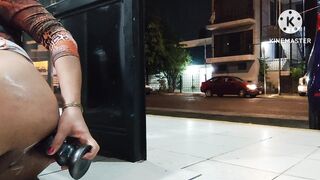Limp sissy clitty dildoing her ass on the open door while cars pass by