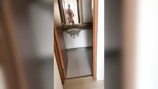 broker enters the apartment, masturbates in front of the mirror and then cums in the sink!