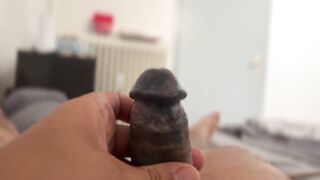 Close up of the tattooed penis with a lot of sperm