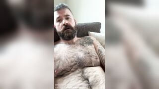 Hairy dad sits back and strokes on the couch, grunting, teasing and edging out a big load