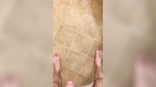 Hairy veiny uncut dick pissing with an erection on the bathroom floor