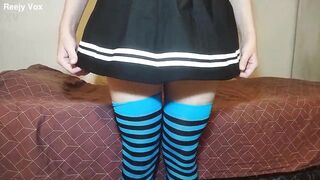 A crossdresser has fun with a new skirt and stockings