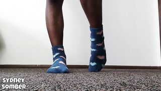 Arched feet in blue socks