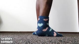 Arched feet in blue socks