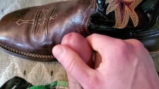 Cowboy cumming on his boots in black Wrangler jeans