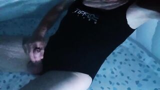 Sissy wearing Black one piece swimsuit on swimming pool