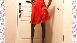 A 1950's SISSY DANCE FOR HER HUSBAND WEARING A PARTY DRESS