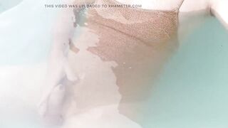 Sissy on sexy gold shiny swimsuit in jacuzzi