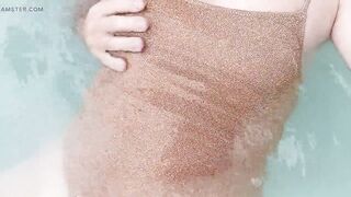 Sissy on sexy gold shiny swimsuit in jacuzzi