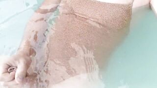 Sissy on sexy gold shiny swimsuit in jacuzzi