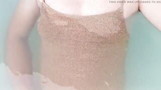 Sissy on sexy gold shiny swimsuit in jacuzzi