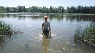 Alexa Cosmic transgirl swimming in clothes in river in jeans shirts and white t-shirt. Alexa Cosmic Wetlook Lover.