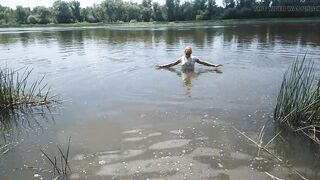 Alexa Cosmic transgirl swimming in clothes in river in jeans shirts and white t-shirt. Alexa Cosmic Wetlook Lover.