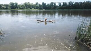 Alexa Cosmic transgirl swimming in clothes in river in jeans shirts and white t-shirt. Alexa Cosmic Wetlook Lover.