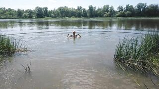 Alexa Cosmic transgirl swimming in clothes in river in jeans shirts and white t-shirt. Alexa Cosmic Wetlook Lover.