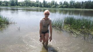 Alexa Cosmic transgirl swimming in clothes in river in jeans shirts and white t-shirt. Alexa Cosmic Wetlook Lover.