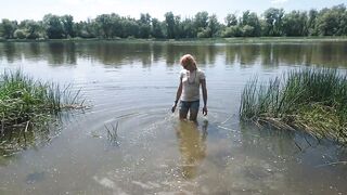 Alexa Cosmic transgirl swimming in clothes in river in jeans shirts and white t-shirt. Alexa Cosmic Wetlook Lover.