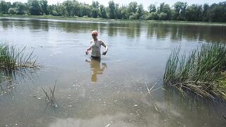 Alexa Cosmic transgirl swimming in clothes in river in jeans shirts and white t-shirt. Alexa Cosmic Wetlook Lover.