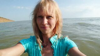 Alexa Cosmic transgirl swimming in the sea first time in teal combi dress